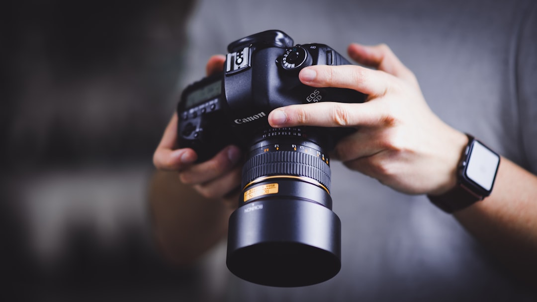 services-03 person-holding-canon-dslr-camera-hfk6xojqlfk