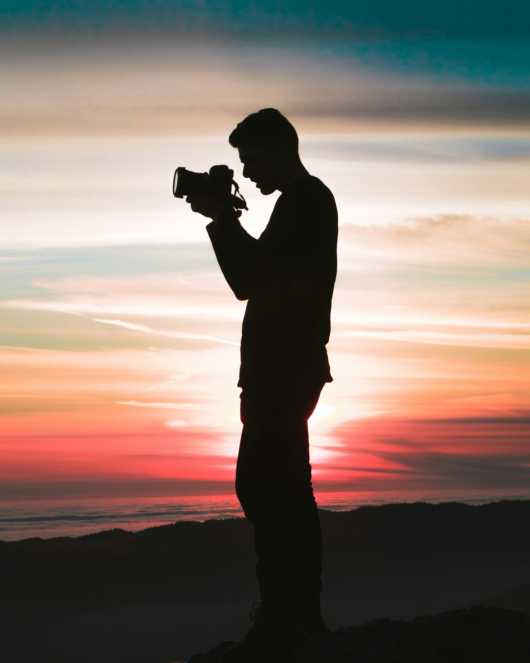 services-04 silhouette-photo-of-man-holding-camera-5oygrn-r9y4